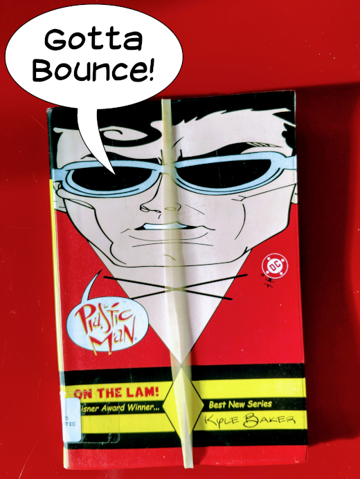 Plastic Man comic book, marked with a rubber band, bouncing away