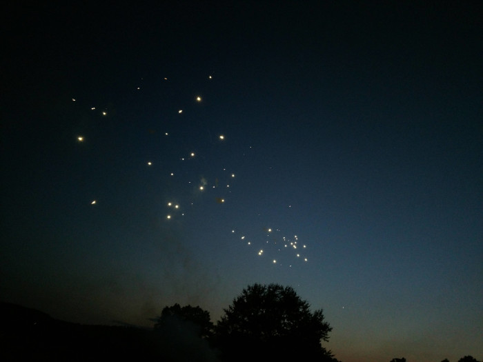 fireworks in the night sky look like bloated stars